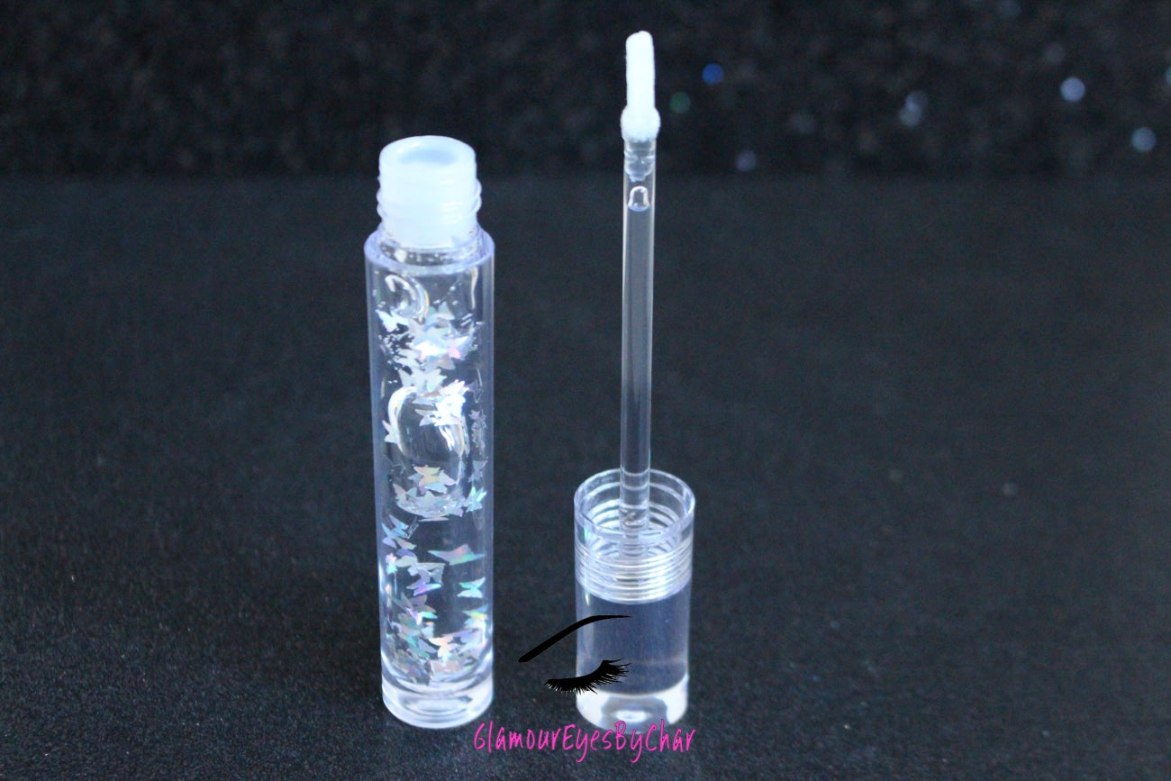 Crystal Clear is a clear handmade hydrating gloss with silver holographic butterflies. This gloss is also vegan, cruelty-free, gluten-free, high shine, smooth and long lasting. It's made with premium rich ingredients to keep your lips soft, moisturized and luscious without feeling sticky. Crystal Clear is available in a squeeze tube and a wand tube (flat doe foot applicator) for a more precise application.