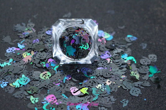 Halloween Mix – Premium Holographic Black Glitter Shapes
Get ready to haunt your look with this eerie blend from our Halloween Collection! Featuring spooky 8mm pumpkins and skulls, 10mm ghosts, 12mm black cats, 6mm bats, and towering 16mm witches, this holographic black mix is perfect for wickedly fun nail art and glitter slime.
Available in 5g jars only.