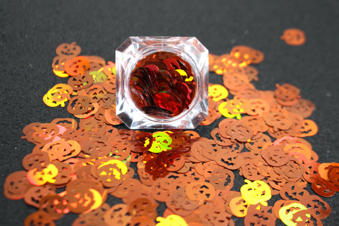 This premium glitter is part of the Halloween collection. It consists of 10mm holographic brown pumpkins. Holographic Pumpkins are perfect for body and nail art. Available in 5g jars only.