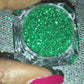 This glitter is called Emerald City and is part of the simple glitter collection. It consists of emerald green glitter.  Emerald City can be used for your face, body, hair and nails. Comes in 5g jars only.