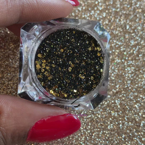 This glitter is called Elegance and is part of the chunky glitter collection. It consists of black and gold glitter with a holographic sparkle. Elegance can be used for your face, body, hair and nails. Comes in 5g jars only.