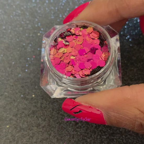 This chameleon glitter is called Fantasy and is part of the super chunky glitter collection. It consists of berry glitter with a gold and green unique colour shifting sparkle. Fantasy can be used for your face, body, hair and nails.  Comes in 5g jars only.
