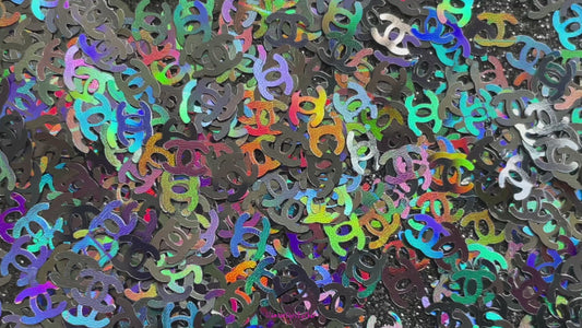 CC Glitter – Premium Chanel-Inspired Holographic Black Letters
Part of our Shaped Glitter Collection, these unique holographic black CC letters add a touch of designer-inspired glam to your nail art and glitter slime.
Available in 5g jars only.