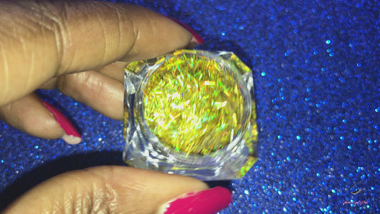 This glitter is called Holographic Gold Strips and is part of the shaped glitters collection. It consists of yellow gold strips with a holographic sparkle. Holographic Gold Strips can be used for your face, body, hair and nails.