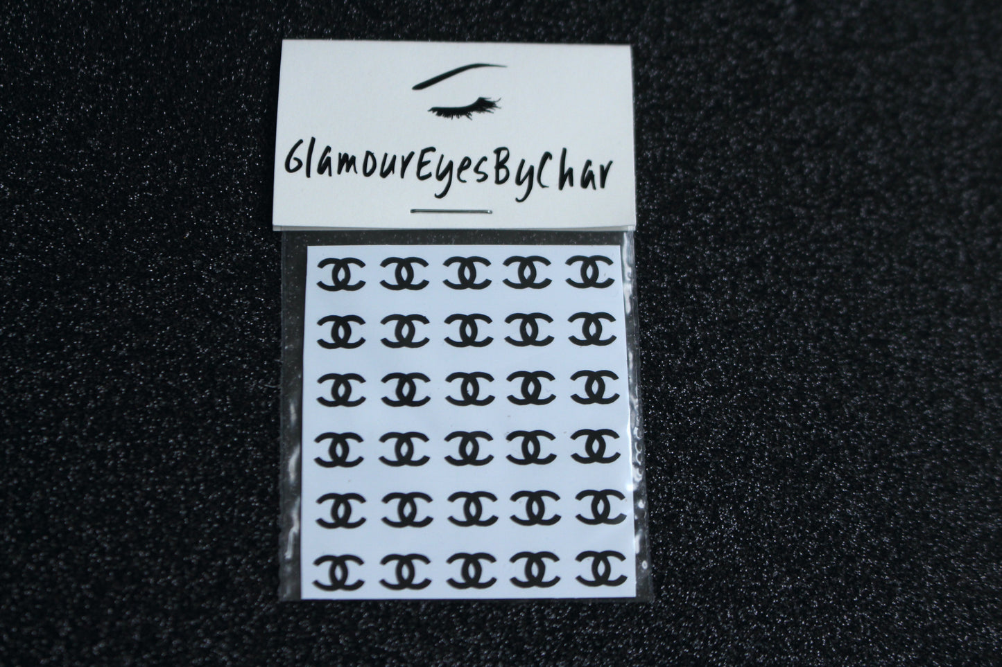 Chanel Inspired Nail Stickers – 30 Pieces (5 Colours)
No need to visit the nail salon—spice up your nails at home with these elegant Chanel designer-inspired nail stickers. Perfect for natural or acrylic nails, you can apply them over regular polish, gel, or shellac.
Handmade with care, these stickers are great for creating chic nail art or adding flair to fun DIY projects.
🌟 Glam Tip: Apply some of our glitter on your nails to really GLAMOUREYES your look.