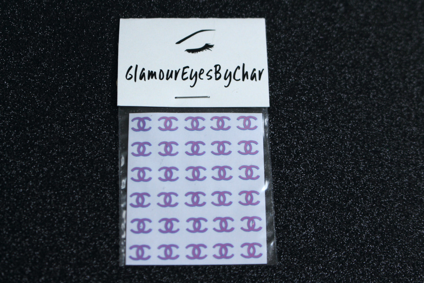 No need to go to the nail salon. Spice up your nails at home with these unique Chanel designer inspired nail decals. They can be used on natural or acrylic nails. You can also easily apply them on top of regular or gel/shellac nail polish. These handmade decals can also be used for body art or any DIY project. Each pack contains 30 decals and is available in 4 different colours.