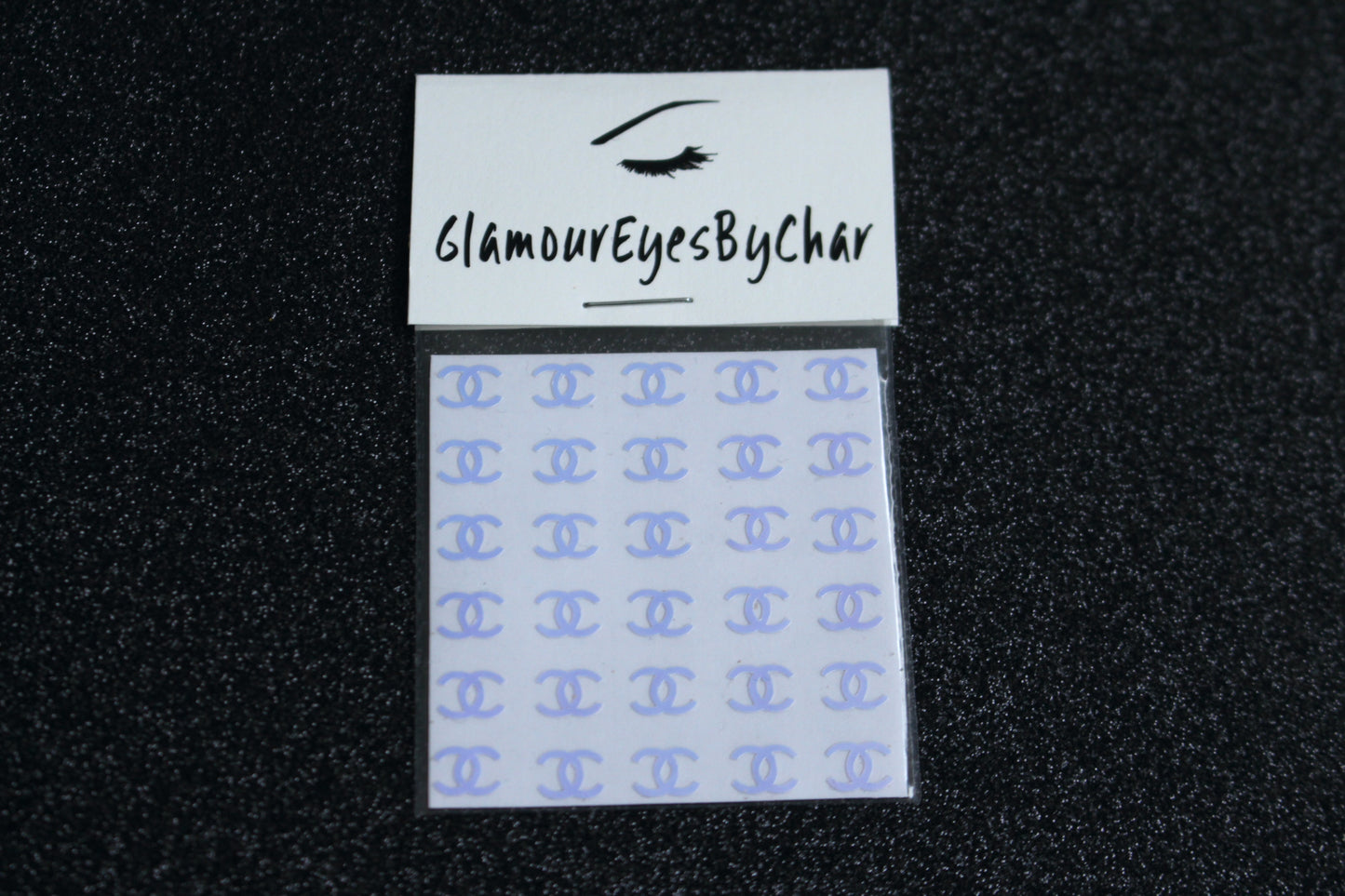 Chanel Inspired Nail Stickers – 30 Pieces (5 Colours)
No need to visit the nail salon—spice up your nails at home with these elegant Chanel designer-inspired nail stickers. Perfect for natural or acrylic nails, you can apply them over regular polish, gel, or shellac.
Handmade with care, these stickers are great for creating chic nail art or adding flair to fun DIY projects.
🌟 Glam Tip: Apply some of our glitter on your nails to really GLAMOUREYES your look.