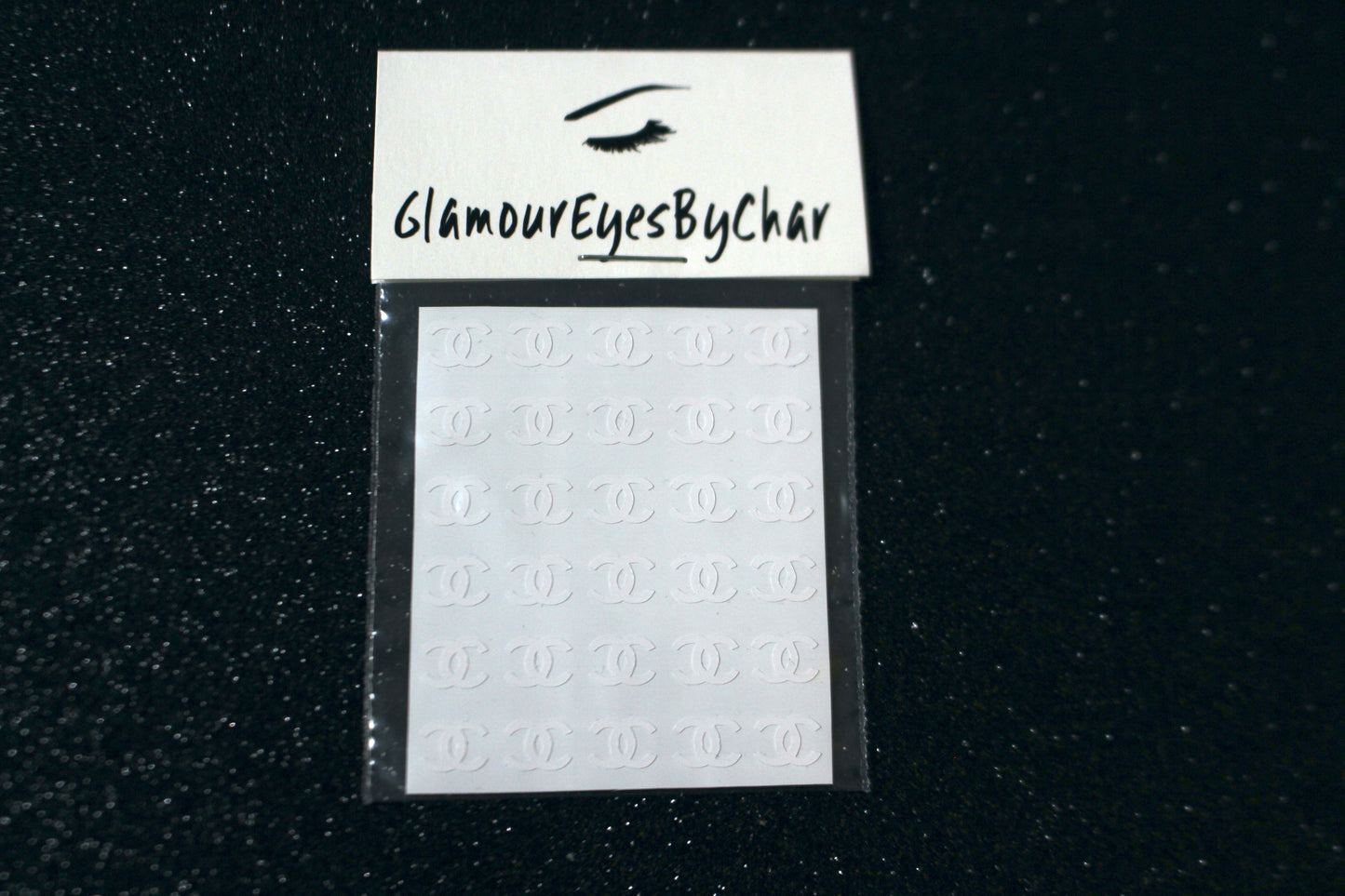 Chanel Inspired Nail Stickers – 30 Pieces (5 Colours)
No need to visit the nail salon—spice up your nails at home with these elegant Chanel designer-inspired nail stickers. Perfect for natural or acrylic nails, you can apply them over regular polish, gel, or shellac.
Handmade with care, these stickers are great for creating chic nail art or adding flair to fun DIY projects.
🌟 Glam Tip: Apply some of our glitter on your nails to really GLAMOUREYES your look.