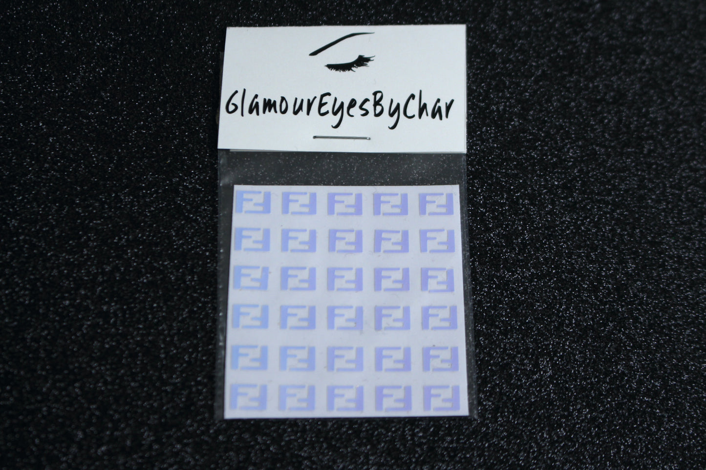 Spice up your nails with these unique FF designer inspired nail decals. They can be used on natural or acrylic nails. You can also apply them on top of regular or gel/shellac nail polish. These handmade decals can also be used for body art or any DIY project. The pack contains 30 decals and is available in 4 different colours. Size: W= 0.3 inches, H= 0.22 inches Tip: Apply some of our glitter on your nails to really GLAMOUREYES your look.