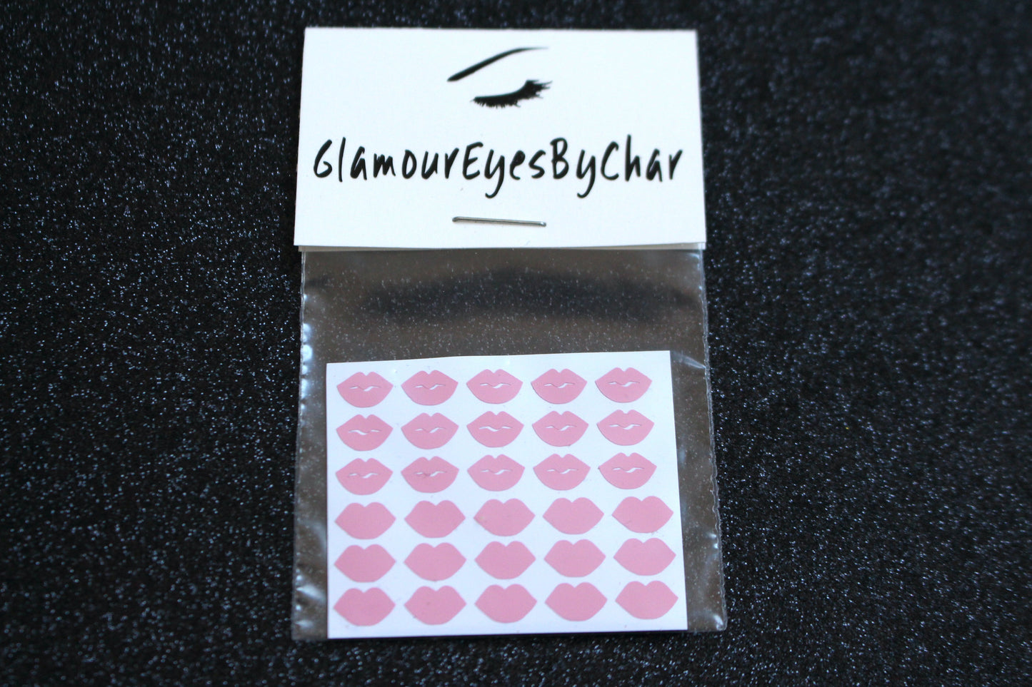 Spice up your nails with these cute lips nail decals. They can be used on natural or acrylic nails. You can also apply them on top of regular or gel/shellac nail polish. These handmade decals can also be used for body art or any DIY project. Each pack contains 30 decals and is available in 3 different colours. Tip: Apply some of our glitter on your nails to really GLAMOUREYES your look.