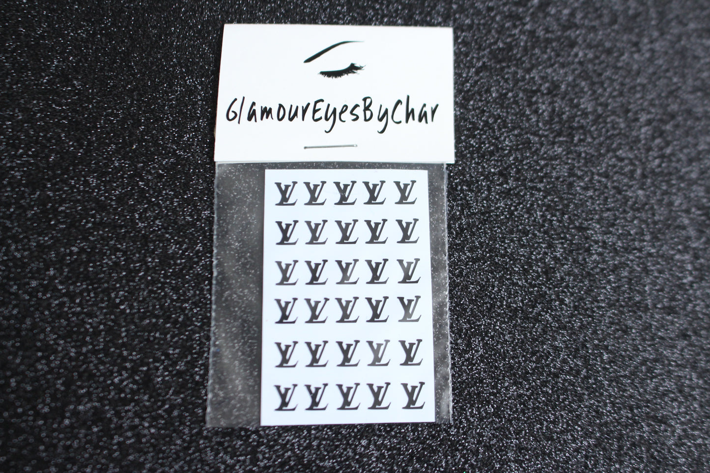 Spice up your nails with these unique LV designer inspired nail decals. They can be used on natural or acrylic nails. You can also apply them on top of regular or gel/shellac nail polish. These handmade decals can also be used for body art or any DIY project. The pack contains 30 decals and is available in 4 different colours.   Size: ﻿W= 0.21 inches, H= 0.252 inches  Tip: Apply some of our glitter on your nails to really GLAMOUREYES your look.