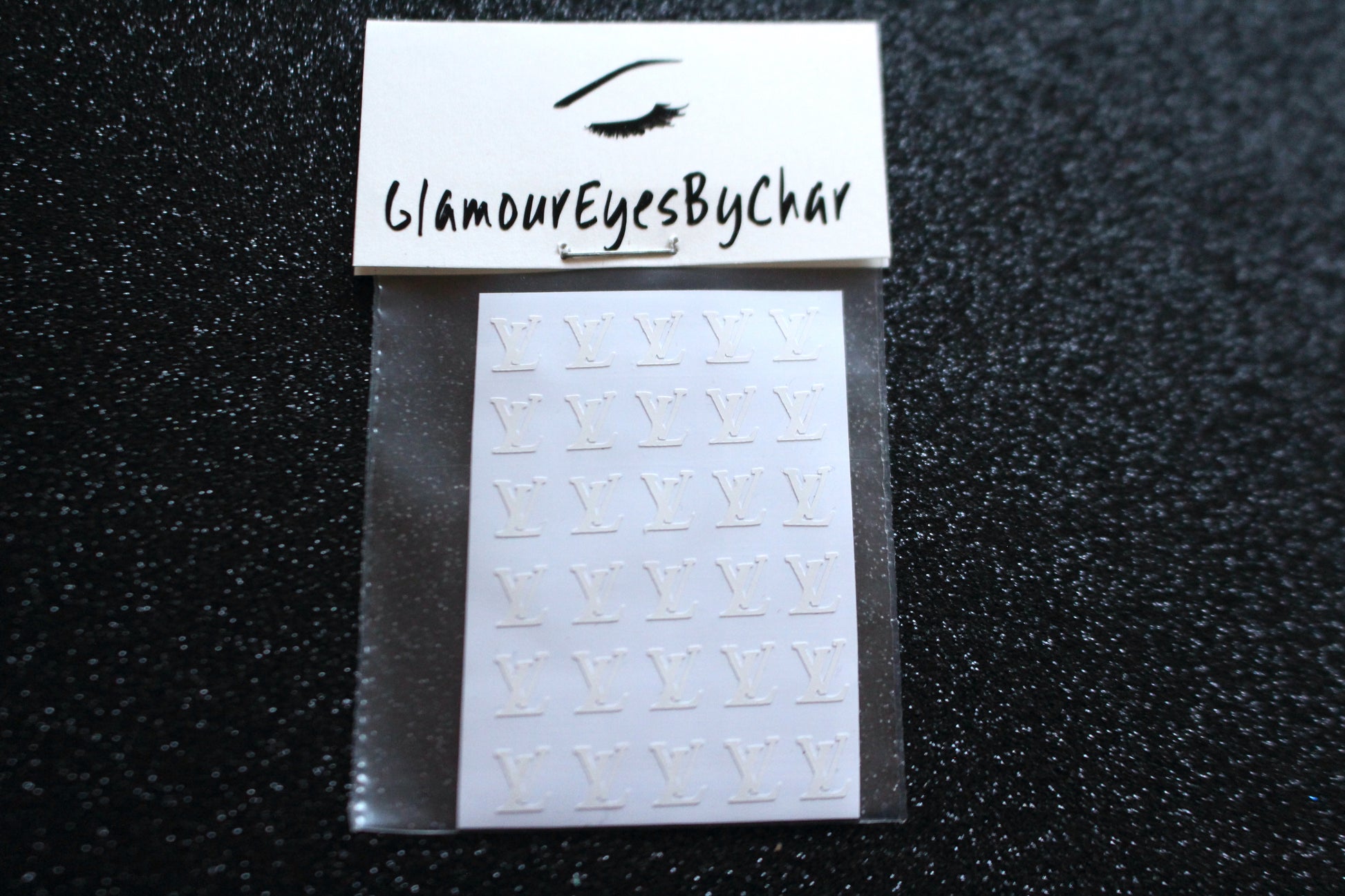 Louis Vuitton Inspired Nail Stickers – 30 Pieces (5 Colours)
No need to visit the nail salon—spice up your nails at home with these chic Louis Vuitton designer-inspired nail stickers. Perfect for natural or acrylic nails, you can apply them over regular polish, gel, or shellac. 
Handmade with care, these stickers are great for creating chic nail art or adding flair to fun DIY projects.
🌟 Glam Tip: Apply some of our glitter on your nails to really GLAMOUREYES your look.