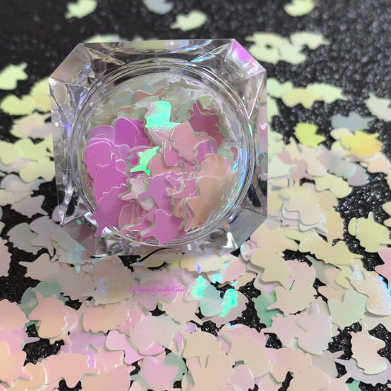 This glitter is called Iridescent Unicorns and is part of the shaped glitters collection. It consists of white iridescent 6.0mm unicorns. Iridescent Unicorns is perfect for body and nail art or DIY projects. Comes in 5g jars only.