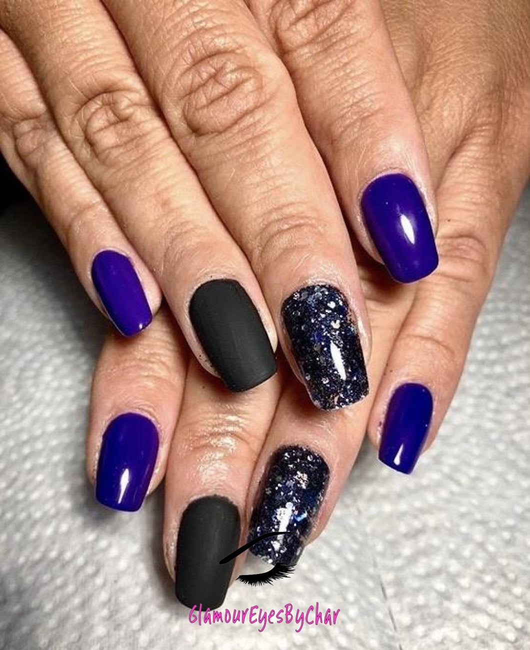 This glitter is called Black Orchid and is part of the super chunky glitter collection. It consists of navy blue/black glitter with a silver and lighter blue holographic sparkle. Black Orchid can be used for your face, body, hair and nails.