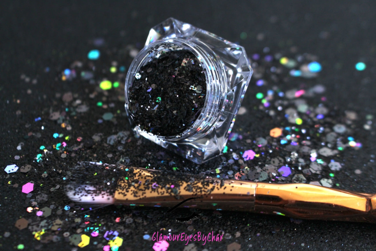 This glitter is called Black Out and is part of the super chunky glitter collection.  It consists of solid jet black glitter. If you'd like a little more sparkle, it also comes in black holographic glitter. Black Out can be used for your face, body, hair and nails.  Comes in 5g jars only.