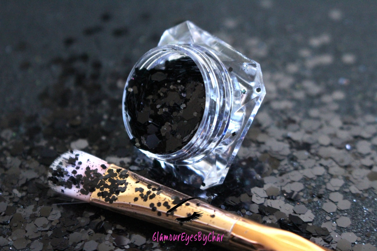 This glitter is called Black Out and is part of the super chunky glitter collection. It consists of solid jet black glitter. If you'd like a little more sparkle, it also comes in black holographic glitter. Black Out can be used for your face, body, hair and nails. Comes in 5g jars only.