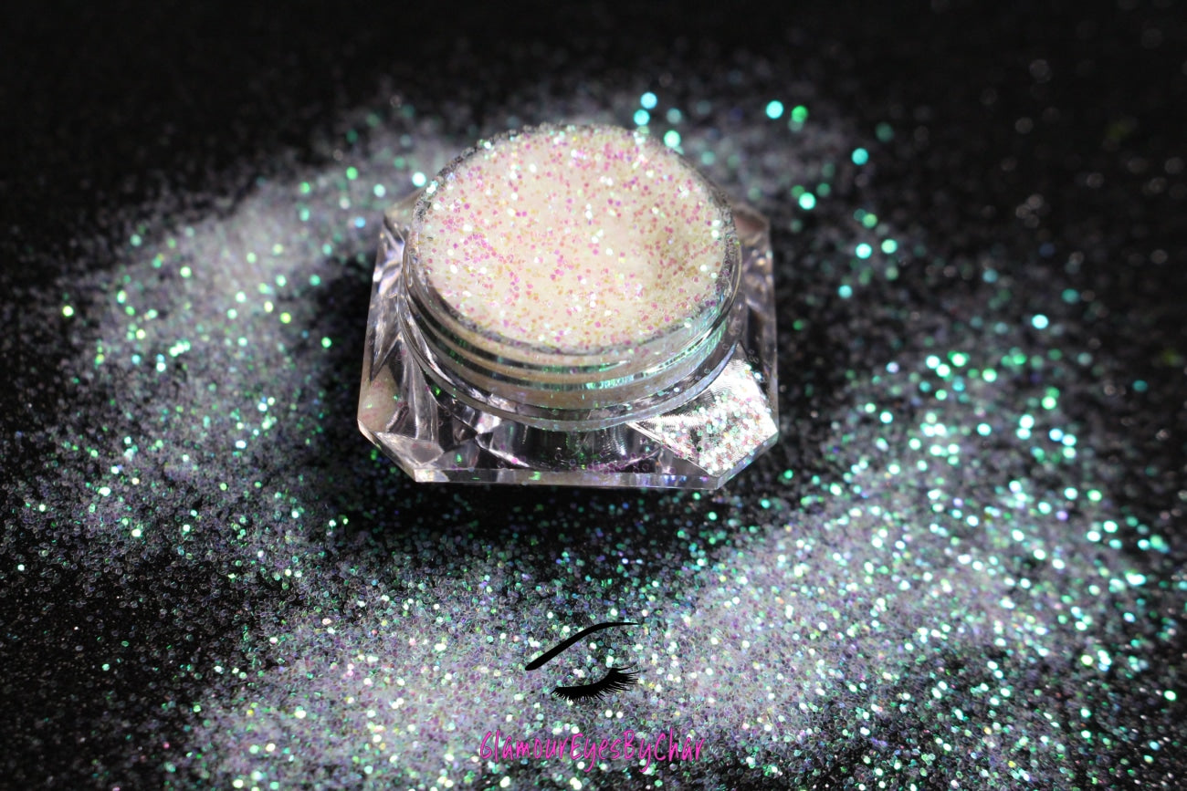 This glitter is called Bride to Be and is part of the simple glitter collection. It consists of white glitter with an iridescent sparkle. Bride to Be can be used for your face, body, hair and nails. Comes in 5g jars only.