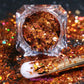 This glitter is called Bronzilla  and is part of the super chunky glitter collection.  It consists of copper glitter with a dazzling holographic sparkle. Bronzilla can be used for your face, body, hair and nails.