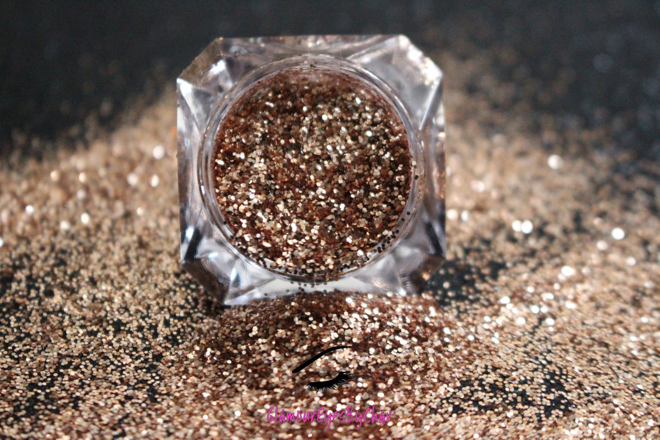 This glitter is called Champagne and is part of the simple glitter collection. It consists of dark champagne gold fine glitter. Champagne can be used for your face, body, hair and nails. Comes in 5g jars only.