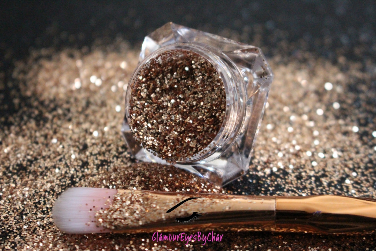 This glitter is called Champagne and is part of the simple glitter collection. It consists of dark champagne gold fine glitter. Champagne can be used for your face, body, hair and nails. Comes in 5g jars only.