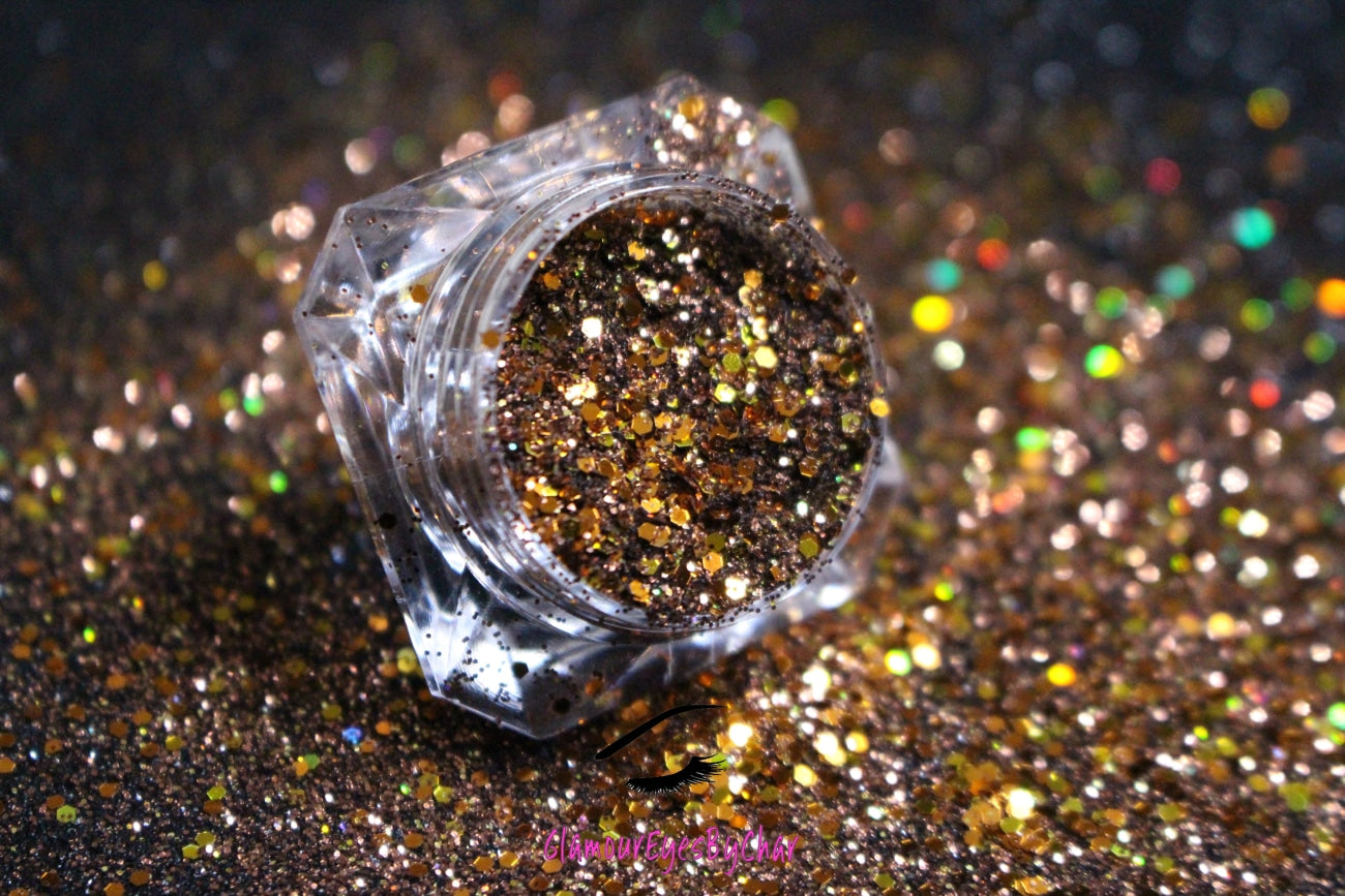 This glitter is called Cinnamon Spice and is part of the chunky glitter collection. It consists of chocolate brown and bronze metallic glitter and has gold holographic sparkle. Cinnamon Spice can be used for your face, body, hair and nails.