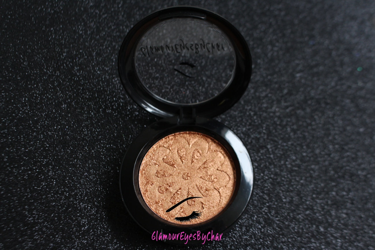  Cleopatra Glamlighter is a copper, gold shade and can be applied as a highlighter or an eyeshadow.   Our handmade pressed glamlighter powder is vegan, pigmented, and silky smooth. It glides right on your skin for an eye catching luminous glow. The buttery formula builds and blends seamlessly without ever looking glittery.