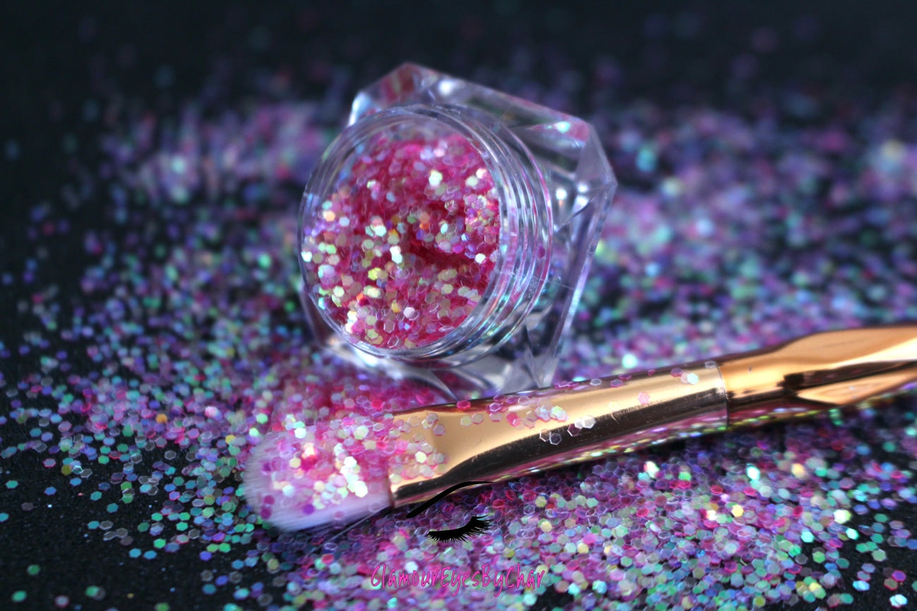 This glitter is called Cotton Candy and is part of the simple glitter collection. It consists of pink glitter with an iridescent sparkle. Flake size is larger than fine and extra fine glitter. Cotton Candy can be used for your face, body, hair and nails. Comes in 5g jars only.