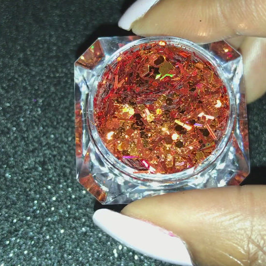 This glitter is called Bronzilla  and is part of the super chunky glitter collection.  It consists of copper glitter with a dazzling holographic sparkle. Bronzilla can be used for your face, body, hair and nails.  Comes in 5g jars only.