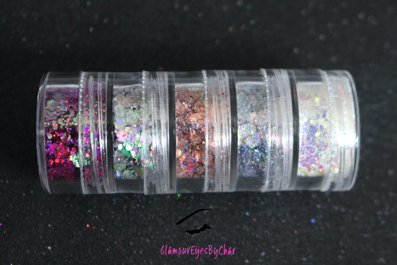 The Dreamland stacker is comprised of dazzling glitters from the super chunky collection. These glitters are perfect for an eye catching look for a night out on the town. The glitters in this set are as follows: Galaxy Illusion She's Perfect Looking Glass Masquerade The Dreamland stacker can be used for your face, body, hair and nails. Available in 5g jars only.