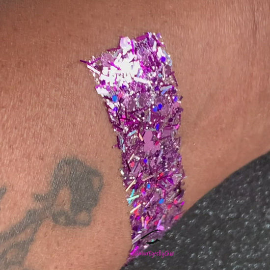 This glitter is called Cupcake and is part of the super chunky glitter collection.  It consists of lilac glitter with a silver holographic sparkle. Cupcake can be used for your face, body, hair and nails.  Comes in 5g jars only. 