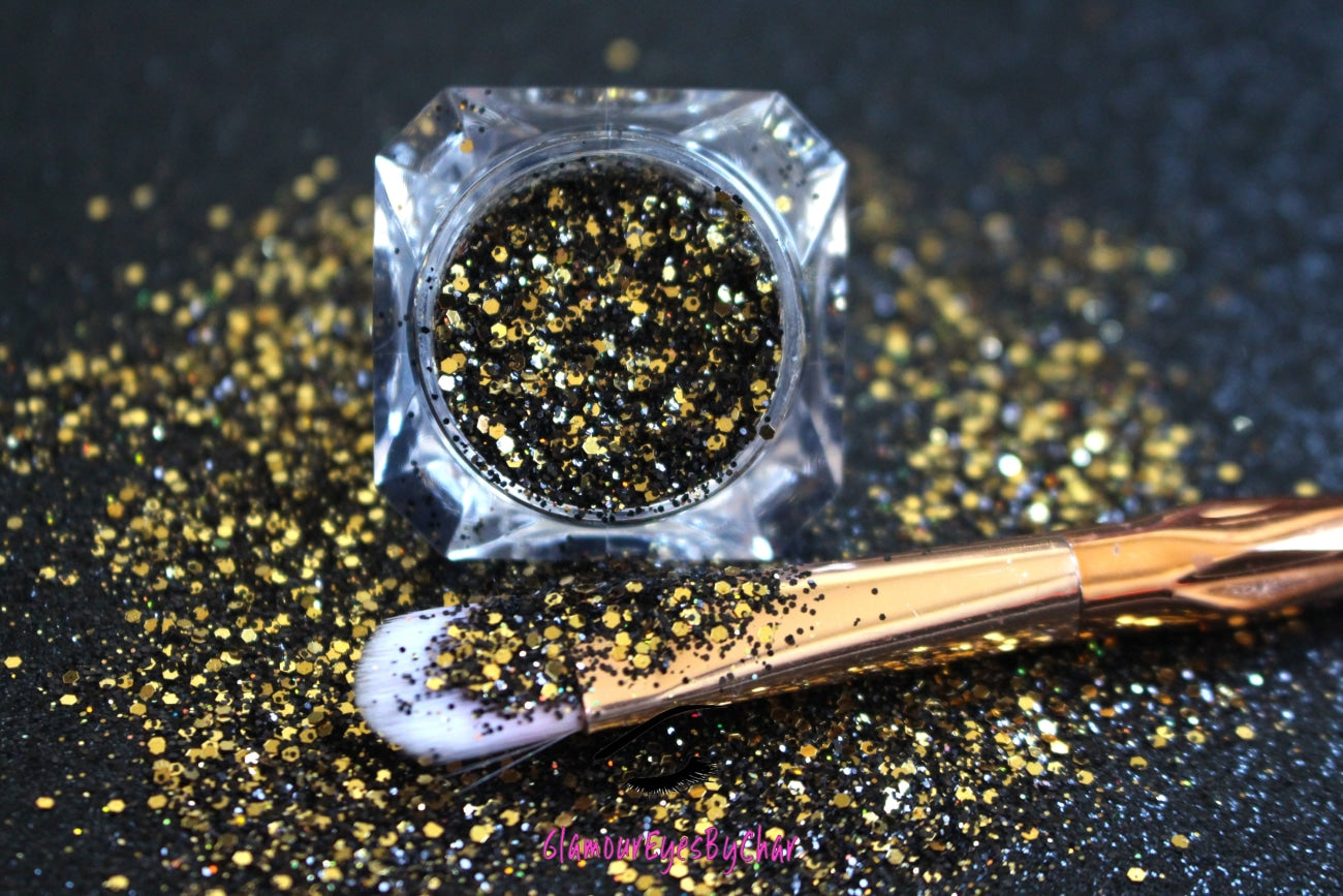 This glitter is called Elegance and is part of the chunky glitter collection. It consists of black and gold glitter with a holographic sparkle. Elegance can be used for your face, body, hair and nails. Comes in 5g jars only.
