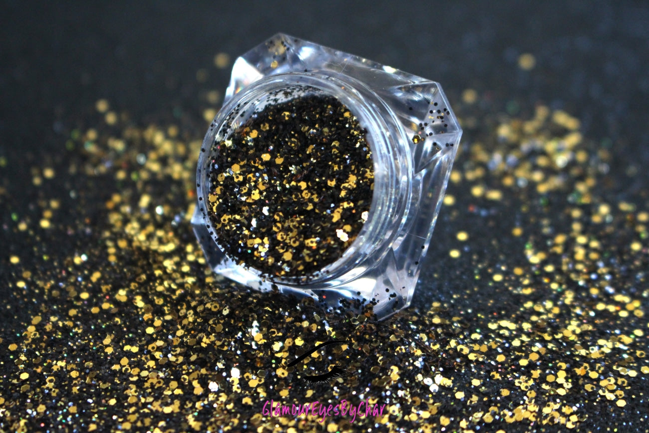 This glitter is called Elegance and is part of the chunky glitter collection. It consists of black and gold glitter with a holographic sparkle. Elegance can be used for your face, body, hair and nails. Comes in 5g jars only.