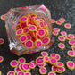 These Grapefruit Fruit Slices are PERFECT for 3D nail or body art. They can also be used for a DIY craft project. The fruit slices are made of polymer clay and are approximately 3mm/0.12 inch in size. Comes in 5g jars only. Note: Grapefruit Fruit Slices are not recommended for use in the immediate eye area. Tip: Apply some of our glitter to your nails to really GLAMOUREYES your look. 