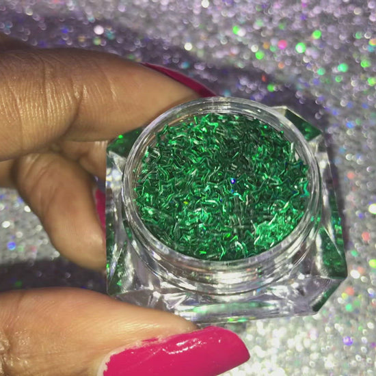 This glitter is called Green Stars and is part of the shaped glitters collection. It consists of emerald green small and large stars. Green Stars is perfect for body and nail art or DIY projects. Comes in 5g jars only. **Glitter will be discontinued once sold out**
