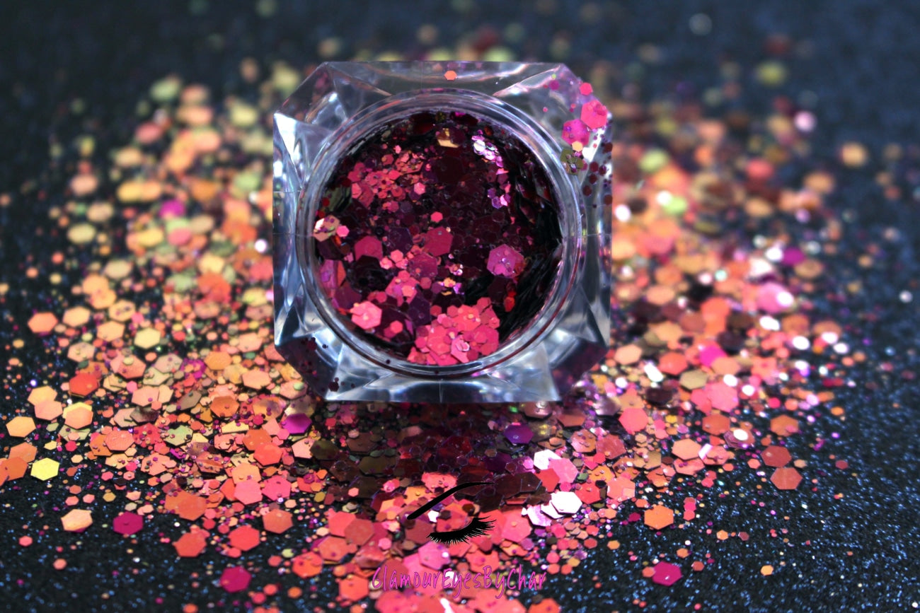 This glitter is called Fantasy and is part of the super chunky glitter collection. It consists of berry, gold and green glitter with a unique colour shifting sparkle. Fantasy can be used for your face, body, hair and nails. Comes in 5g jars only.
