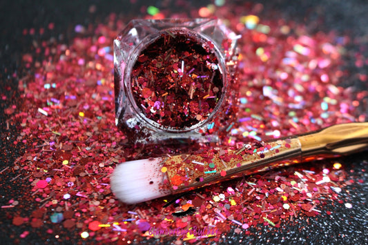 This glitter is called Fireworks and is part of the super chunky glitter collection.  It consists of garnet red and silver glitter with a dazzling holographic sparkle. Fireworks can be used for your face, body, hair and nails.  Comes in 5g jars only. **Glitter will be discontinued once sold out**