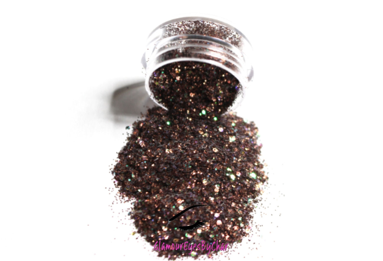 This glitter is called Fondue and is part of the chunky glitter collection. It consists of chocolate brown glitter with an iridescent sparkle. Fondue can be used for your face, body, hair and nails. Comes in 5g and 10g jars.  **Glitter will be discontinued once sold out**