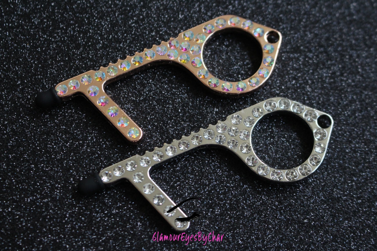 Are you or someone you know concerned with touching things such as door handles, buttons etc. in public? Well, look no further because you've clicked on the right product! Our Glam Contactless Door Opener is the solution for you. It's sparkly multifunctional design can be used to open doors, push buttons, move chairs, and even works on touchscreens. It prevents germs to keep you safe and stop the spread by limiting exposure to infected surfaces in day-to-day activities.