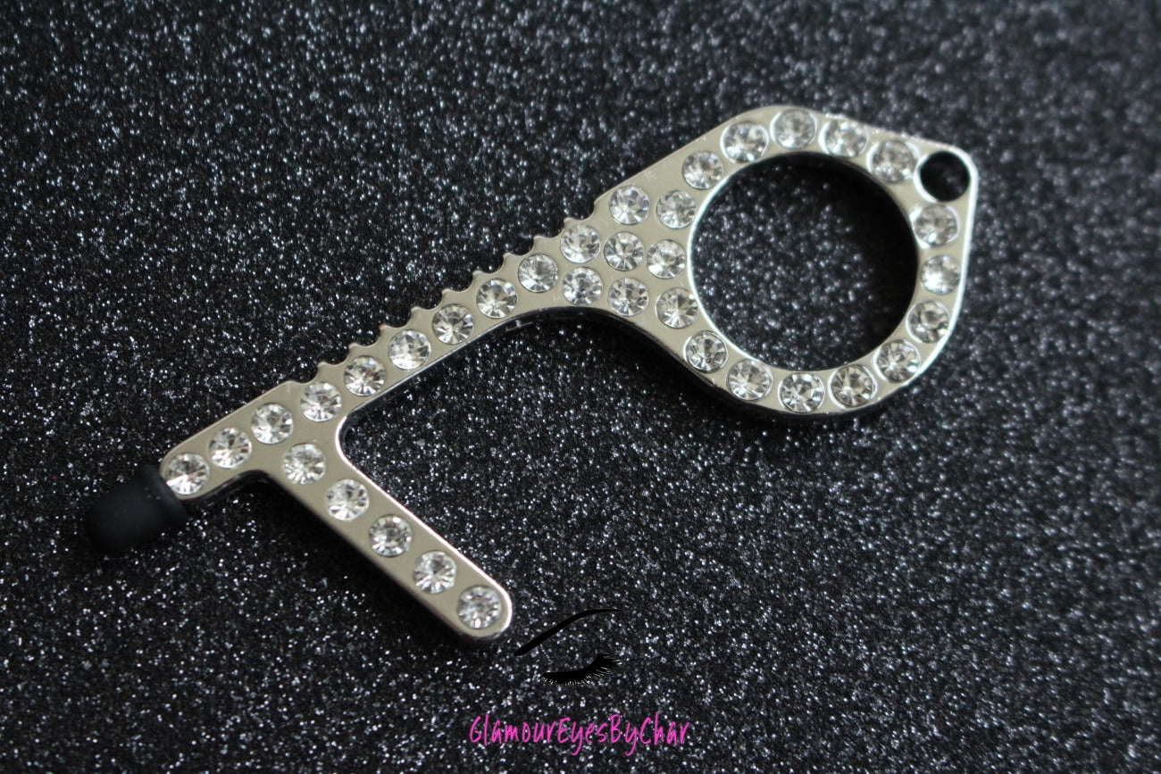 Are you or someone you know concerned with touching things such as door handles, buttons etc. in public? Well, look no further because you've clicked on the right product! Our Glam Contactless Door Opener is the solution for you. It's sparkly multifunctional design can be used to open doors, push buttons, move chairs, and even works on touchscreens.  It prevents germs to keep you safe and stop the spread by limiting exposure to infected surfaces in day-to-day activities.