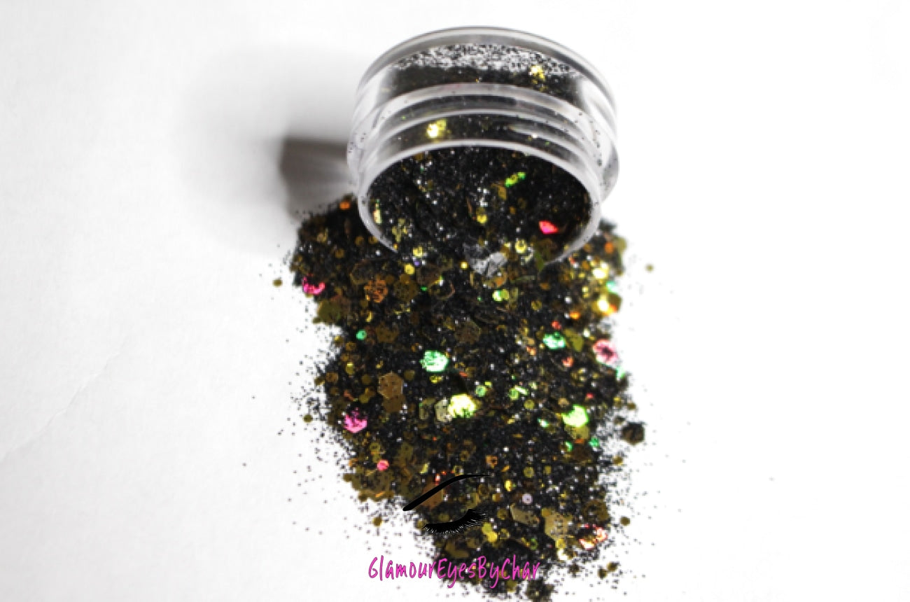 This glitter is called Gold Mine and is part of the super chunky glitter collection.  It consists of black and gold glitter with a holographic dazzling sparkle. Gold Mine can be used for your face, body, hair and nails.  Comes in 5g jars only.