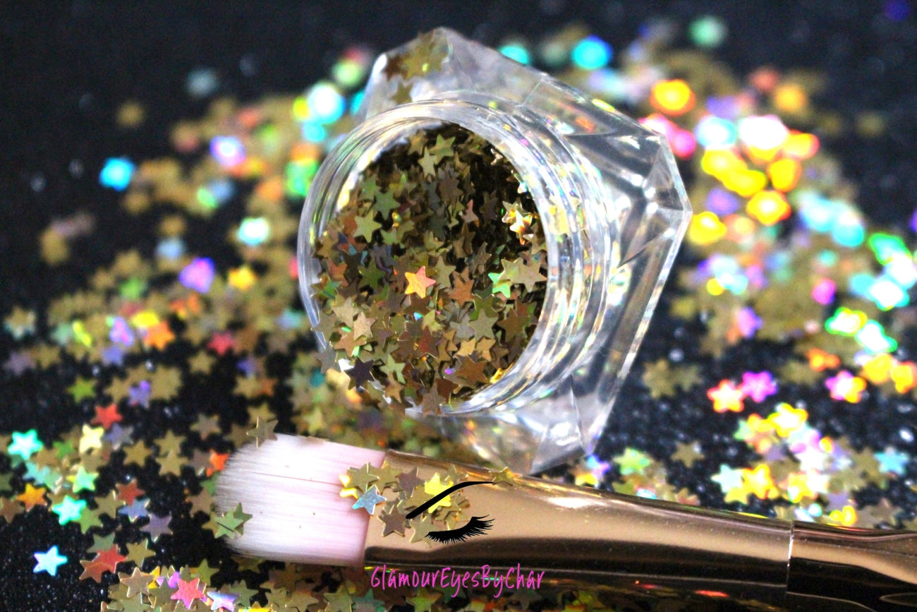 This glitter is called Holographic Gold Stars and is part of the shaped glitters collection. It consists of gold small stars with a holographic sparkle. Holographic Gold Stars is perfect for body and nail art or DIY projects. Comes in 5g jars only.
