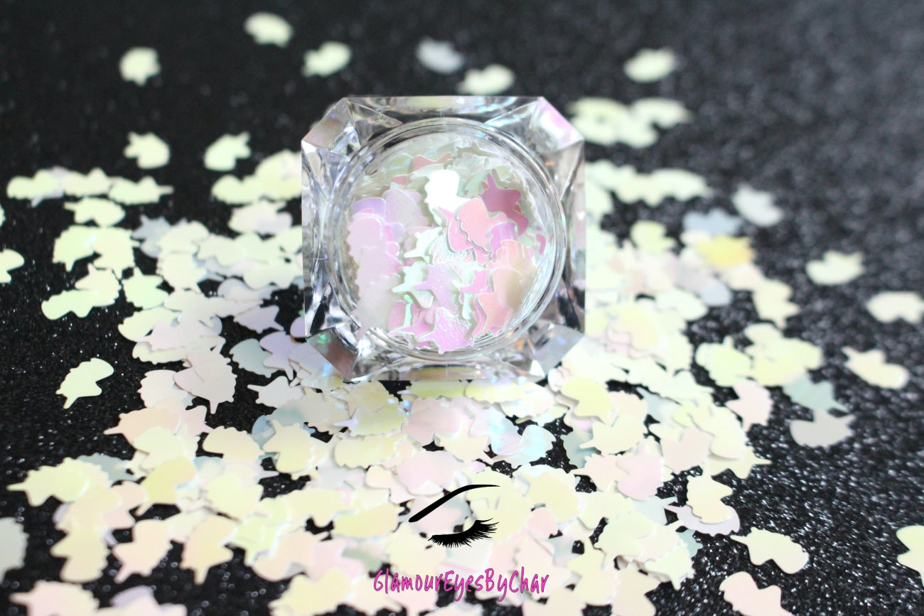 This glitter is called Iridescent Unicorns and is part of the shaped glitters collection. It consists of white iridescent 6.0mm unicorns. Iridescent Unicorns is perfect for nail and body art. Comes in 5g jars only.
