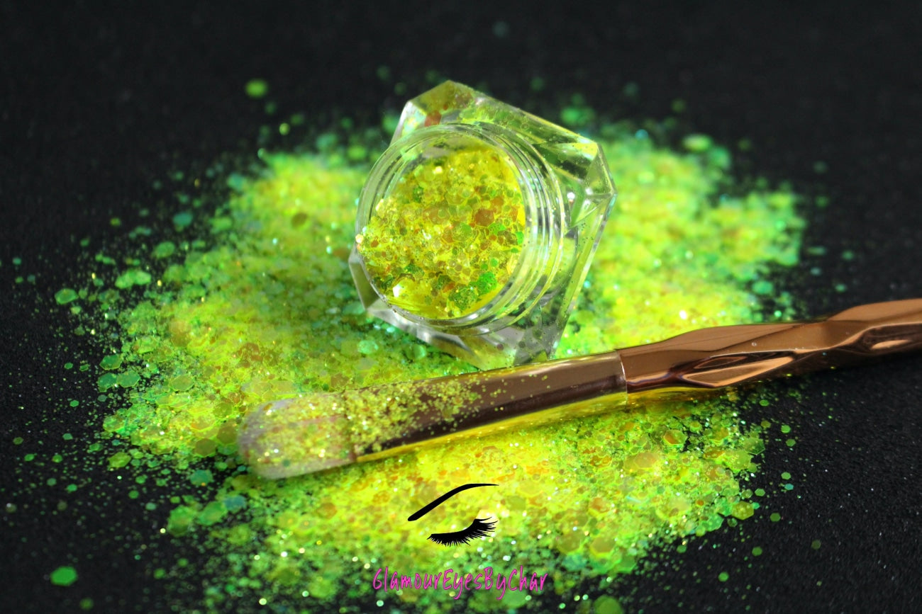 This glitter is called Lemon Lime and is part of the super chunky glitter collection. It consists of fluorescent iridescent green glitter that may look yellow depending on how the light reflects. Lemon Lime can be used for your face, hair, body and nail art, glitter slime, resin art or DIY projects. Comes in 5g jars only.
