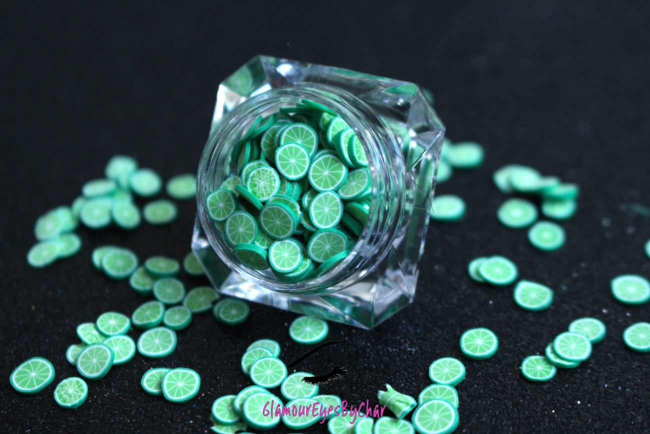 These Lime Fruit Slices are PERFECT for 3D nail or body art. They can also be used for a DIY craft project. The fruit slices are made of polymer clay and are approximately 3mm/0.12 inch in size. Note: Lime Fruit Slices are not recommended for use in the immediate eye area. Tip: Apply some of our glitter to your nails to really GLAMOUREYES your look.