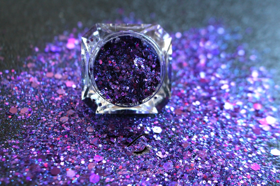 This glitter is called Love Spell and is part of the super chunky glitter collection. It consists of deep purple and violet glitter with a holographic sparkle. Love Spell can be used for your face, body, hair and nails. Comes in 5g jars only.