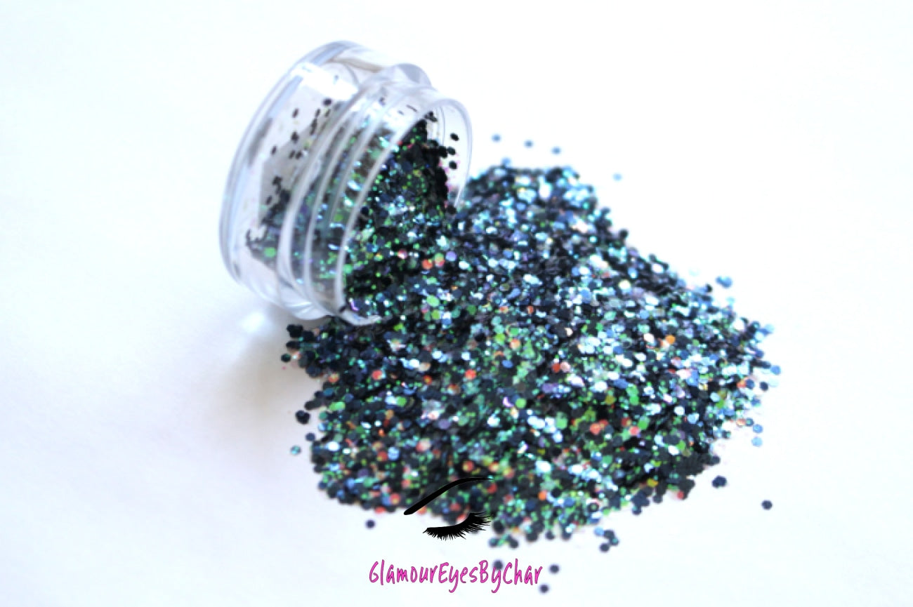This glitter is called Mermaid Delight and is part of the chunky glitter collection. It consists of navy blue glitter with a white iridescent sparkle. Mermaid Delight can be used for your face, body, hair and nails. Comes in 5g jars only. **Glitter will be discontinued once sold out**
