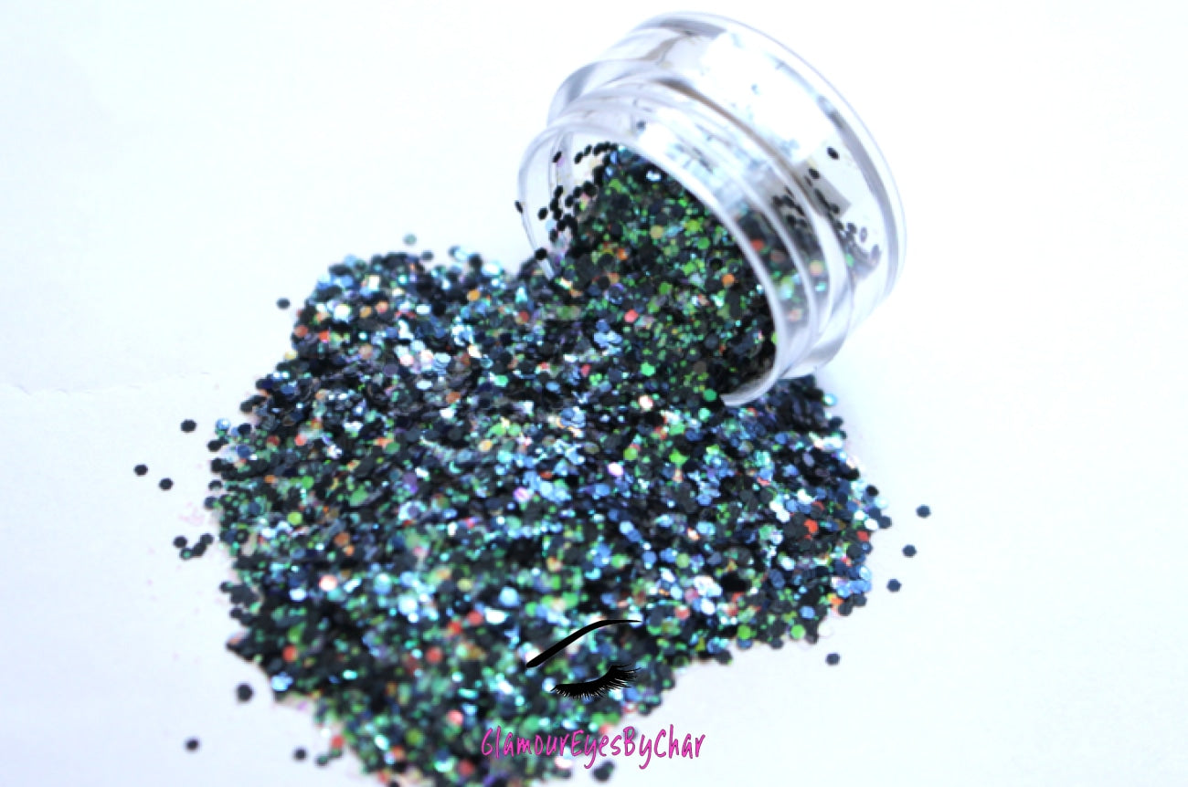 This glitter is called Mermaid Delight and is part of the chunky glitter collection. It consists of navy blue glitter with a white iridescent sparkle. Mermaid Delight can be used for your face, body, hair and nails. Comes in 5g jars only. **Glitter will be discontinued once sold out**
