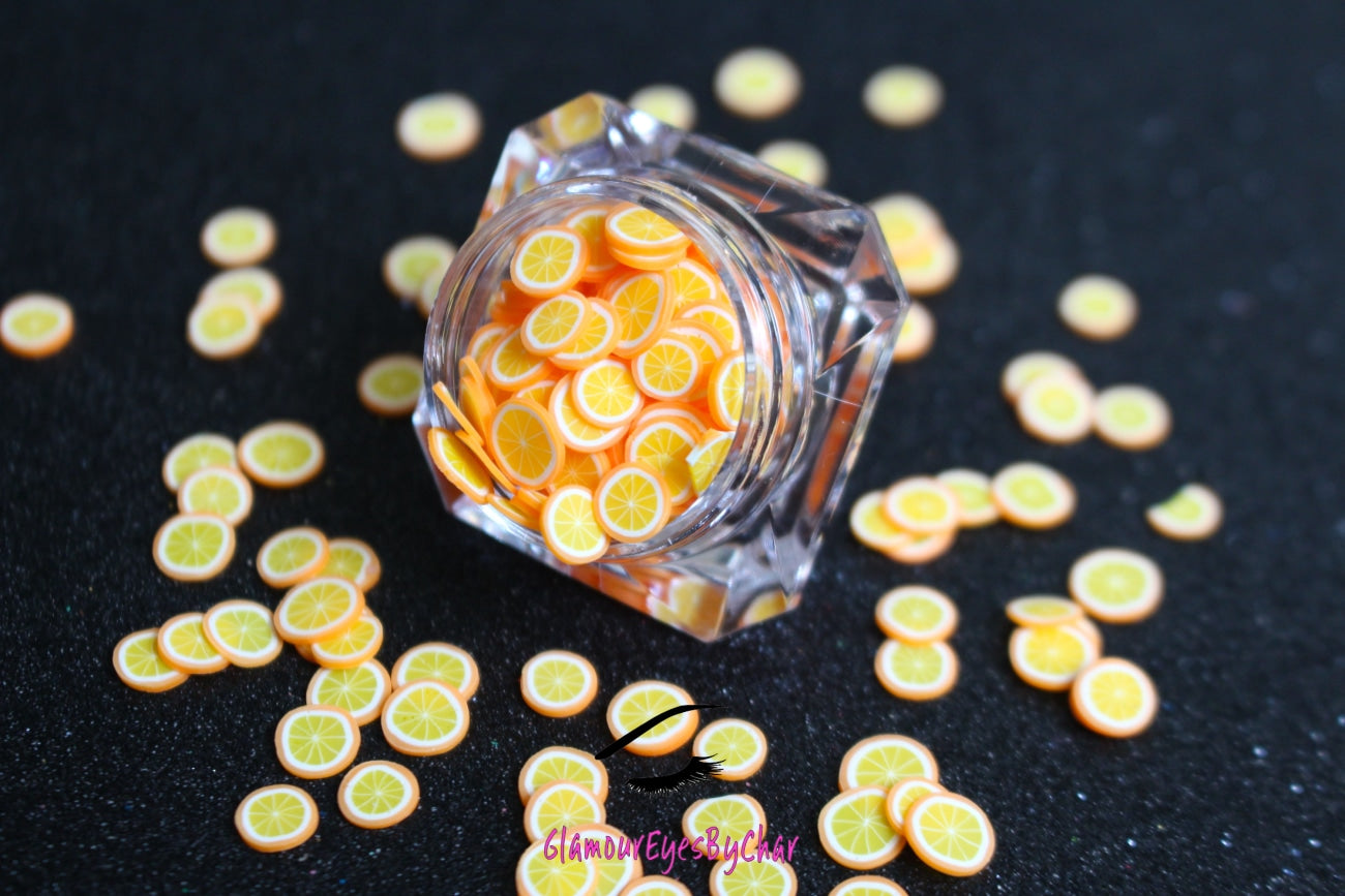 These Orange Fruit Slices are PERFECT for 3D nail or body art. They can also be used for a DIY craft project. The fruit slices are made of polymer clay and are approximately 3mm/0.12 inch in size. Comes in 5g jars only. Note: Orange Fruit Slices are not recommended for use in the immediate eye area. Tip: Apply some of our glitter to your nails to really GLAMOUREYES your look.