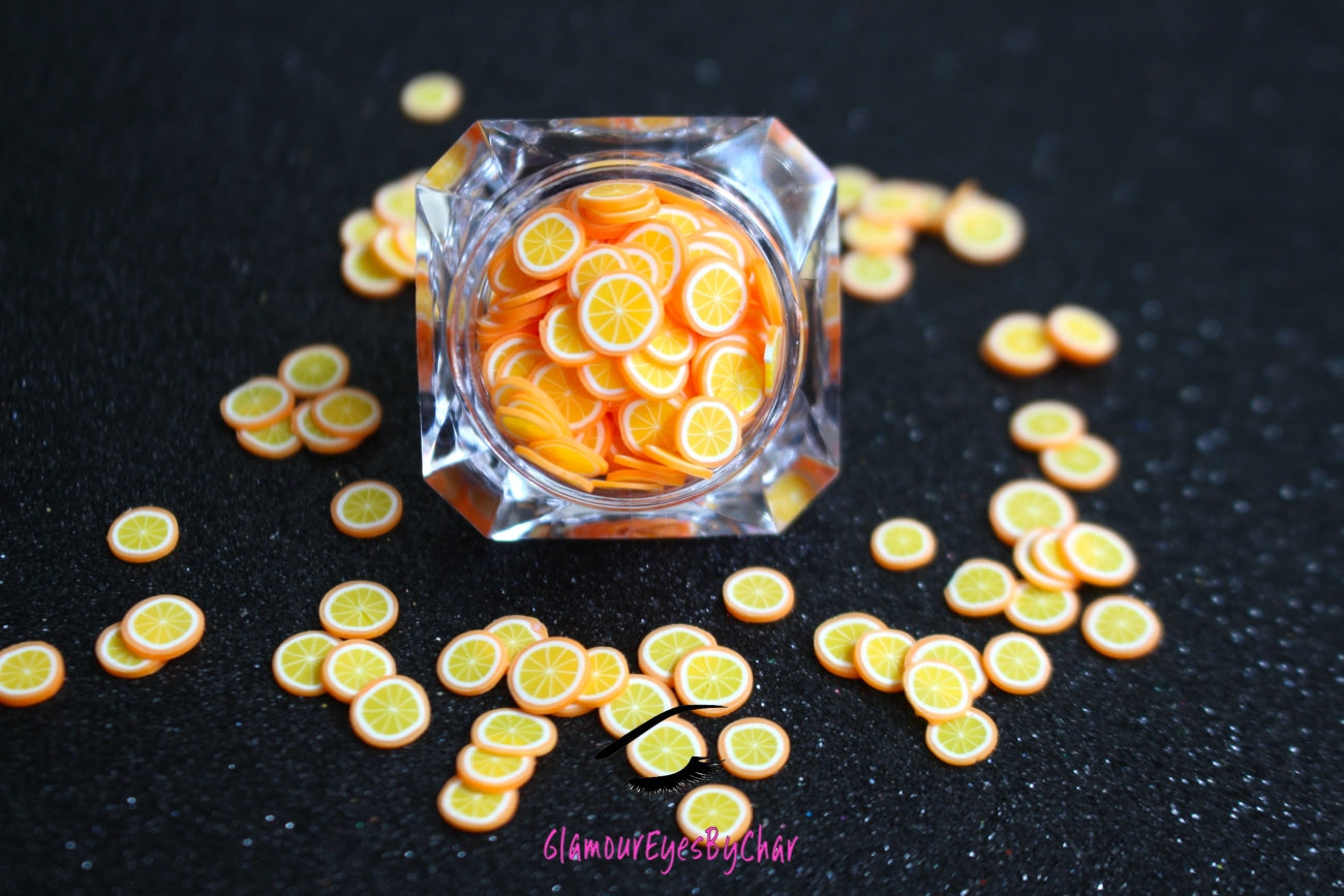 These Orange Fruit Slices are PERFECT for 3D nail or body art. They can also be used for a DIY craft project. The fruit slices are made of polymer clay and are approximately 3mm/0.12 inch in size. Comes in 5g jars only. Note: Orange Fruit Slices are not recommended for use in the immediate eye area. Tip: Apply some of our glitter to your nails to really GLAMOUREYES your look.