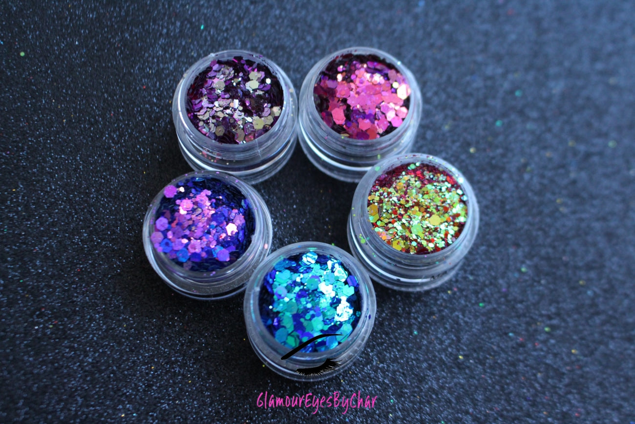 The Party Girl stacker is comprised of glitters from the super chunky collection. These glitters are perfect for an eye catching look for a night out on the town. The glitters in this set are as follows: Daydream Fantasy Mardi Gras Deep Sea Hypnotic The Party Girl stacker can be used for your face, body, hair and nails. Available in 5g jars only.